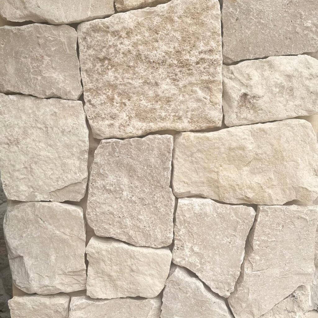 Sorrento travertine wall with soft cream tones and lightly textured square and rectangular stone pieces