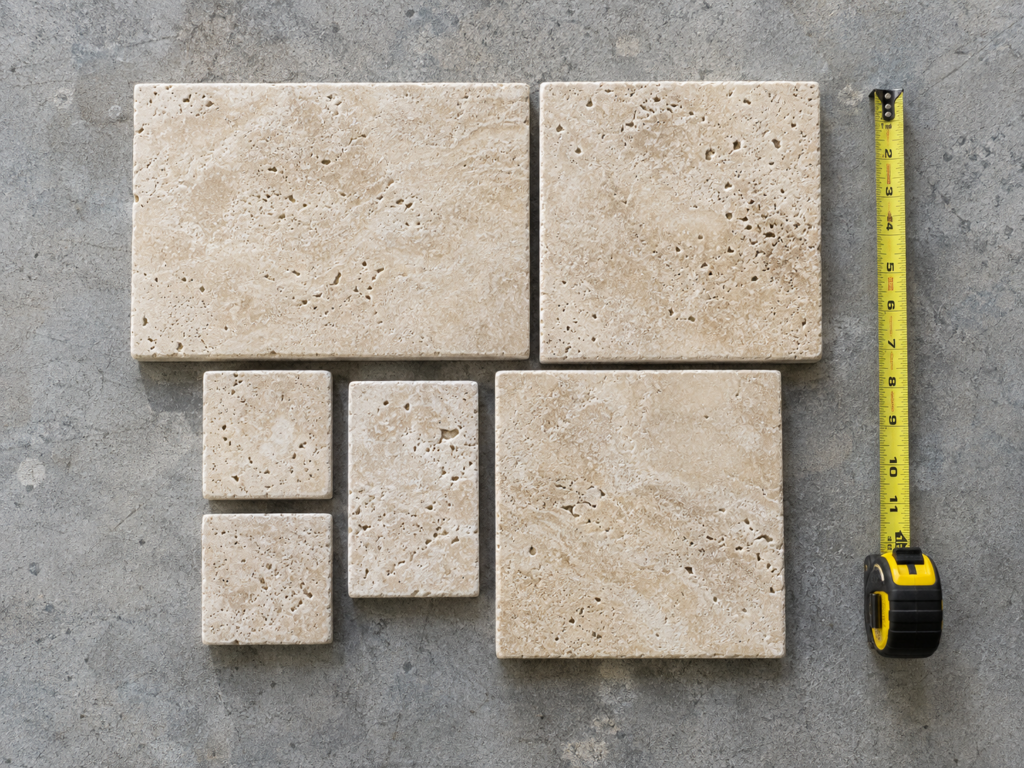 Six-piece French pattern travertine set dry-laid showing the four paver sizes